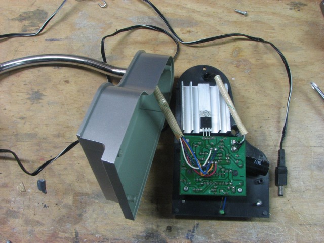Picture showing the base of the globe removed, with circuit board, heat sink, and connection to the arm.